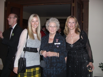 three ladies and, in background, John Neill