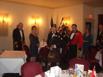 David Hjalmarsen pipes in the head table