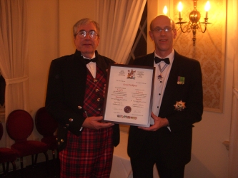 Gerald McKinnon receiving certificate