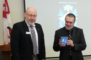 Steve Cowan presents to Andrew Andersen a table shield