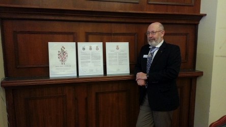 Steve Cowan beside his grant documents