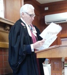 Judge Push in a robe at podium