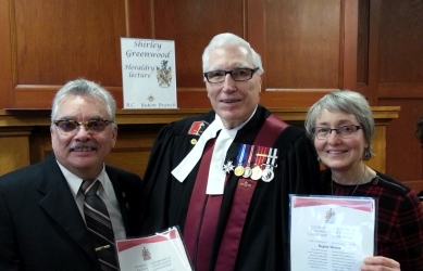 Judge Pash between Brian Hutchison and Regina Mercer holding certificates