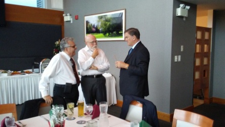 Brian Hutchison and Denis Ostercamp talking to Gary Mitchell