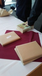 brown-wrapped books on a table
