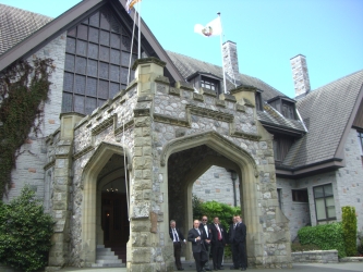 board members assembling at the entrance to Government House